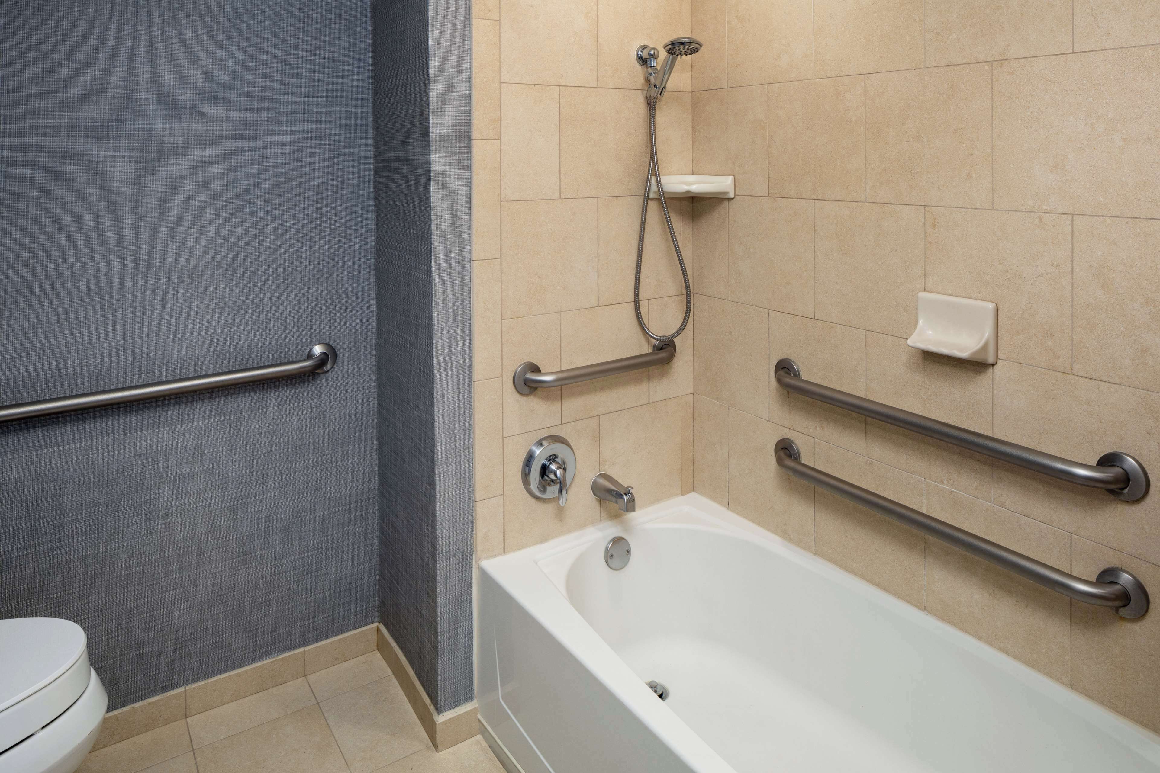 rainfall showerhead, designer toiletries, hair dryer, towels