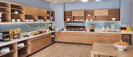A modern kitchen with wooden cabinets, a tiled backsplash, and a breakfast bar.