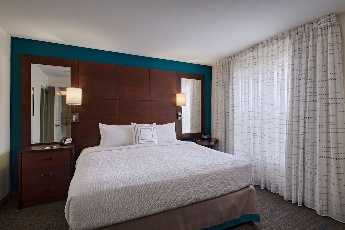 desk, laptop workspace, blackout curtains, iron/ironing board