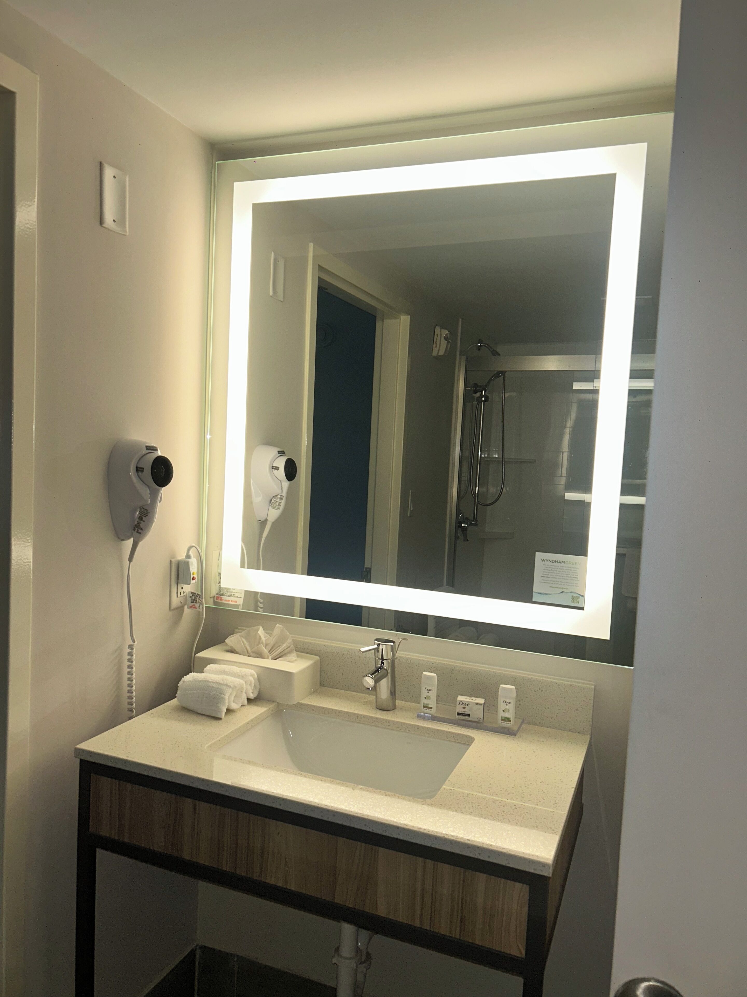 designer toiletries, hair dryer, towels