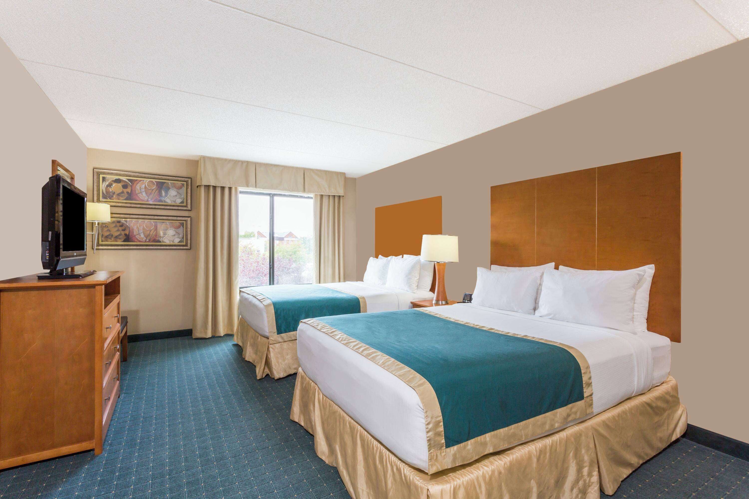 room, 2 queen beds, non smoking (mobility, bathtub w/ grab bars) | pillow-top beds, in-room safe, desk, laptop workspace