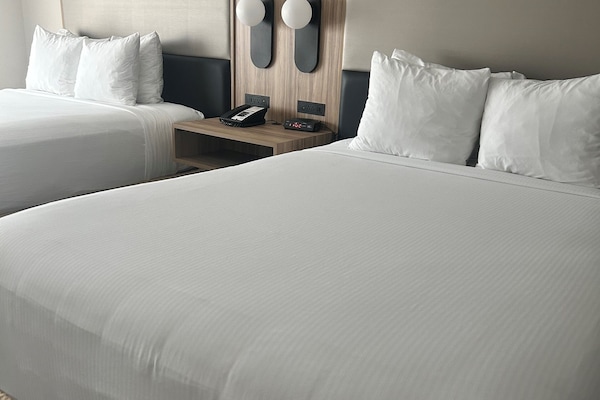 Standard Room, 2 Queen Beds, Non Smoking | Pillowtop beds, in-room safe, desk, laptop workspace