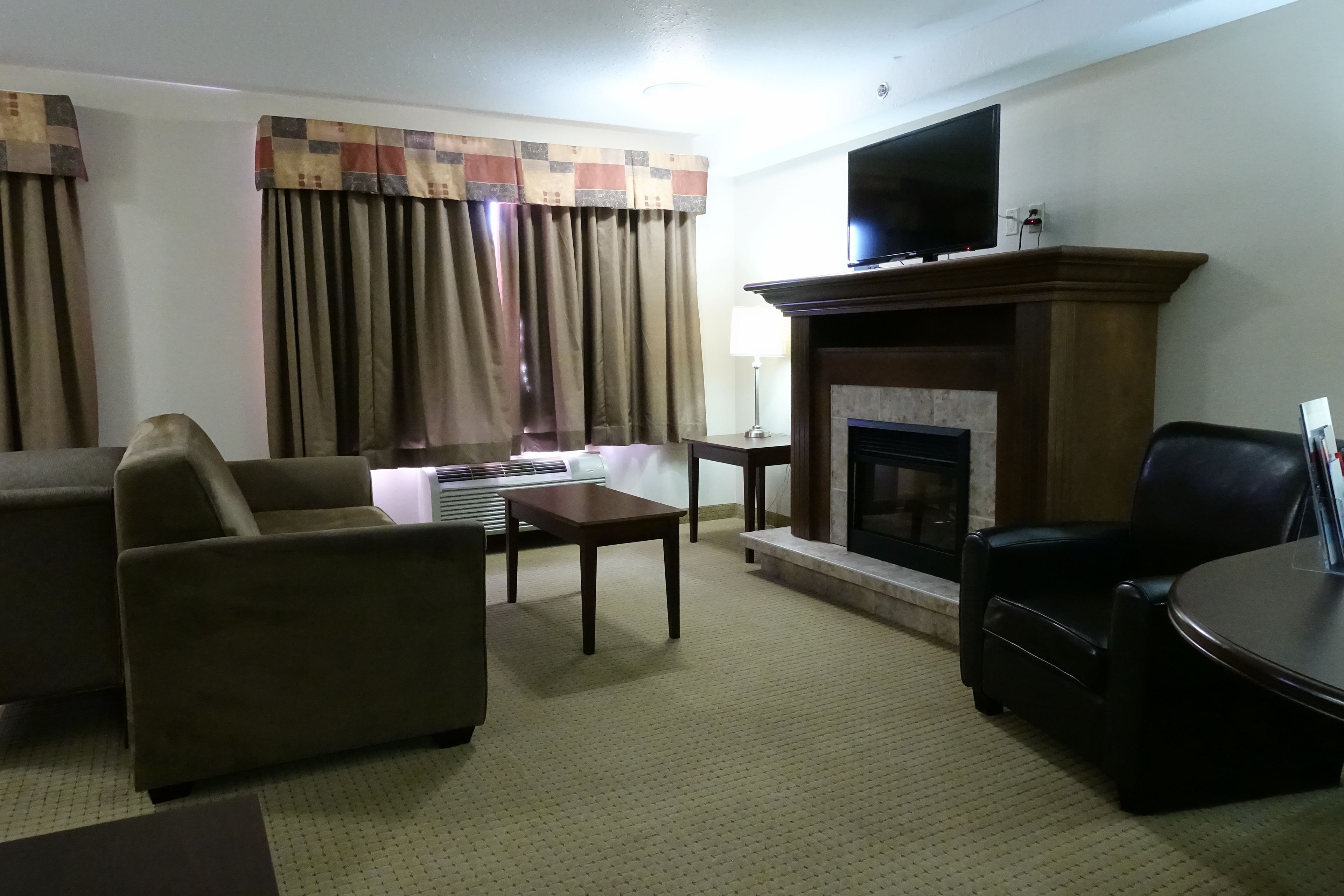 suite, 1 queen bed, non smoking | desk, laptop workspace, iron/ironing board, cots/infant beds