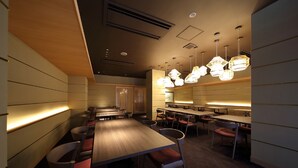 A modern restaurant with wooden tables and chairs, pendant lighting, and a warm ambiance. - Kyoto Hotel SANOYA (Kyoto)