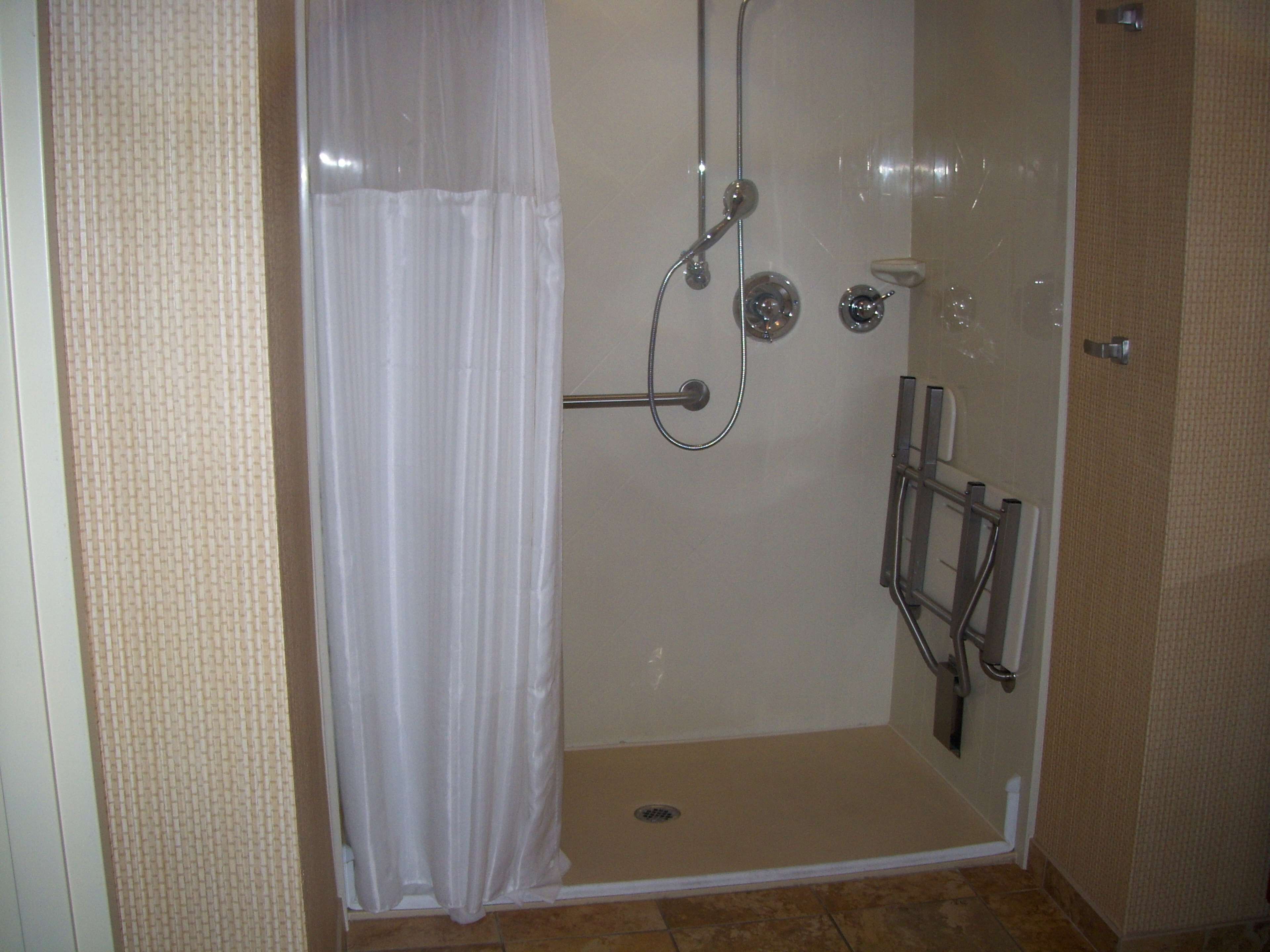 A walk-in shower with a shower curtain, a handheld showerhead, a handheld showerhead, a handheld showerhead, a handheld showerhead, a handheld showerhead, a handheld showerhead, a handheld showerhead, a handheld showerhead, a handheld showerhead, a handheld showerhead, a handheld showerhead, a handheld showerhead, a handheld showerhead, a handheld showerhead, a handheld showerhead, a handheld showerhead, a handheld showerhead, a handheld showerhead, a handheld showerhead, a handheld showerhead, a handheld showerhead, a handheld showerhead, a handheld showerhead, a handheld showerhead, a handheld showerhead, a handheld showerhead, a handheld showerhead, a handheld showerhead, a handheld showerhead, a handheld showerhead, a handheld showerhead, a handheld showerhead, a handheld showerhead, a handheld showerhead, a handheld showerhead, a handheld showerhead, a handheld showerhead, a handheld shower