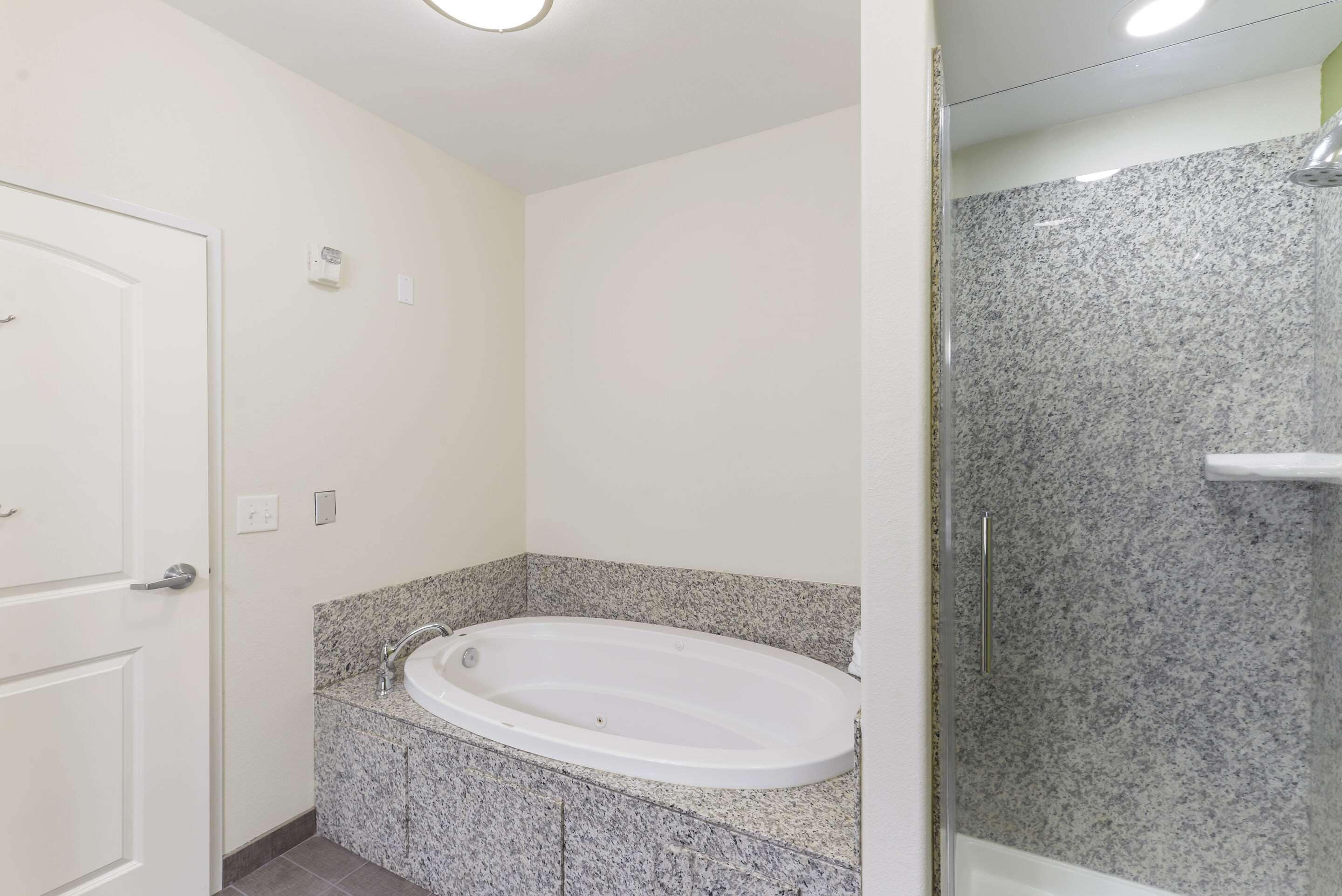 room, 1 king bed, non smoking, jetted tub | bathroom | free toiletries, hair dryer, towels, soap