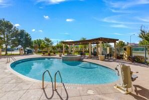 Outdoor pool, open 6:00 AM to 10:00 PM, pool loungers