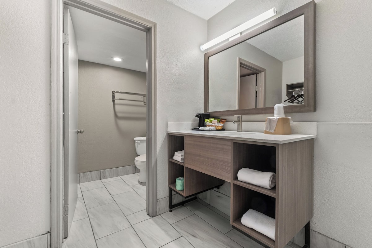 combined shower/bathtub, hair dryer, towels, soap
