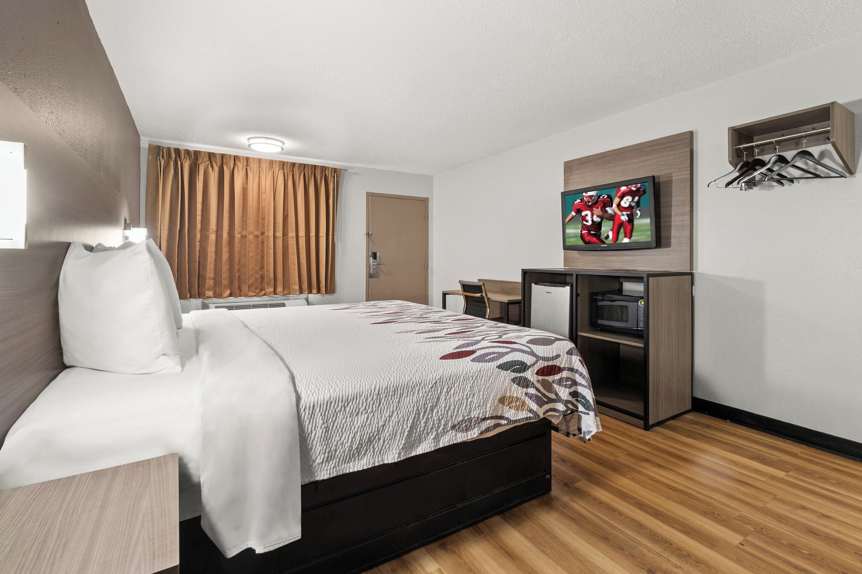 deluxe room, 1 king bed, smoking | 1 bedroom, desk, laptop workspace, blackout curtains