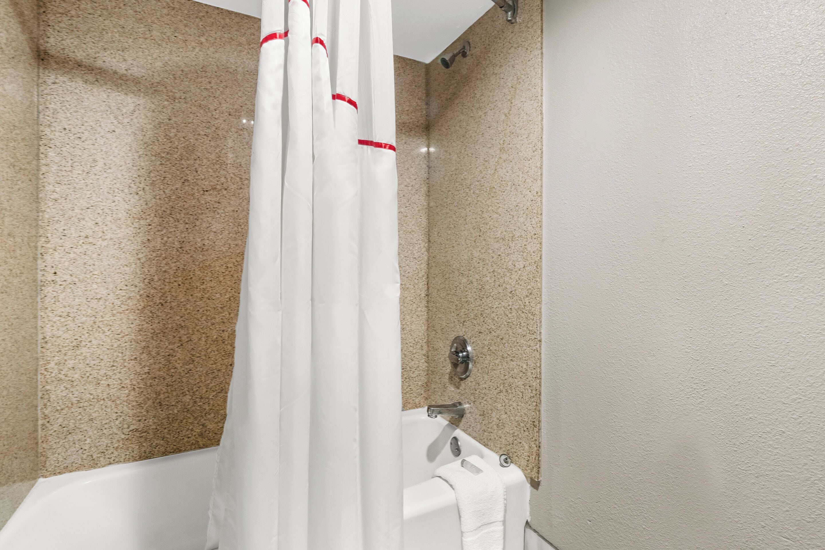 combined shower/bathtub, hair dryer, towels, soap
