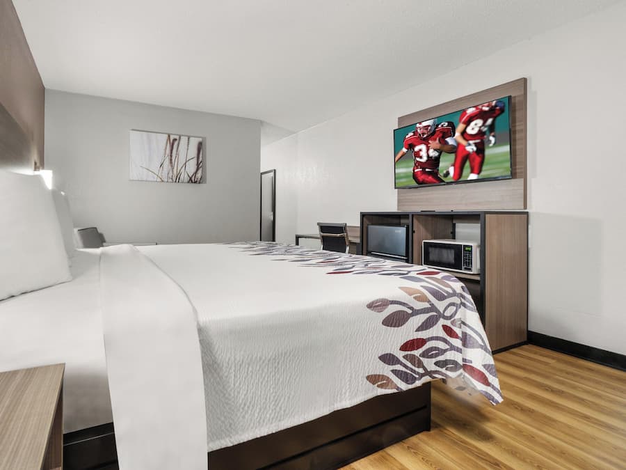 Desk, laptop workspace, blackout drapes, iron/ironing board