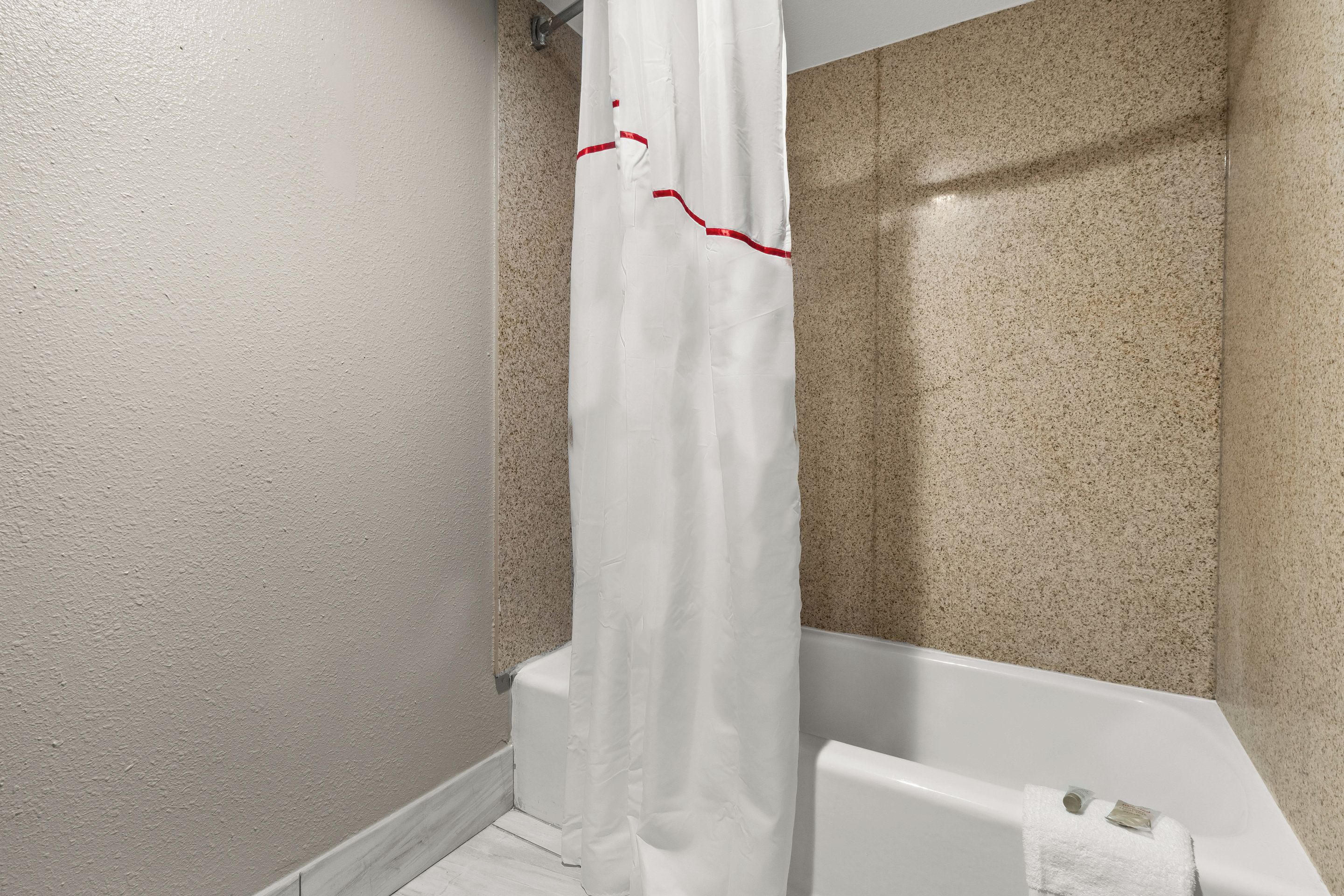 Combined shower/tub, hair dryer, towels, soap