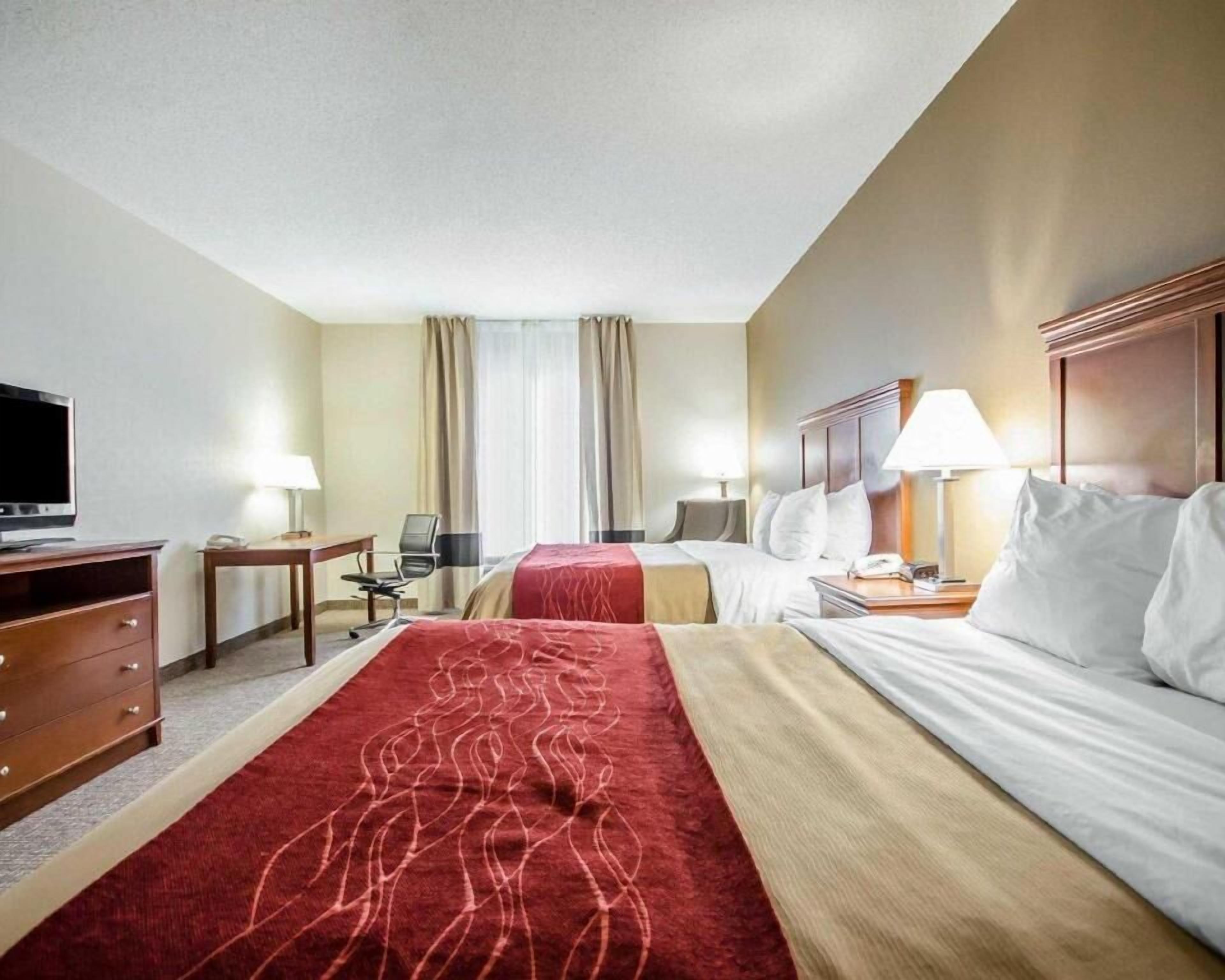 Pillow-top beds, desk, blackout curtains, iron/ironing board