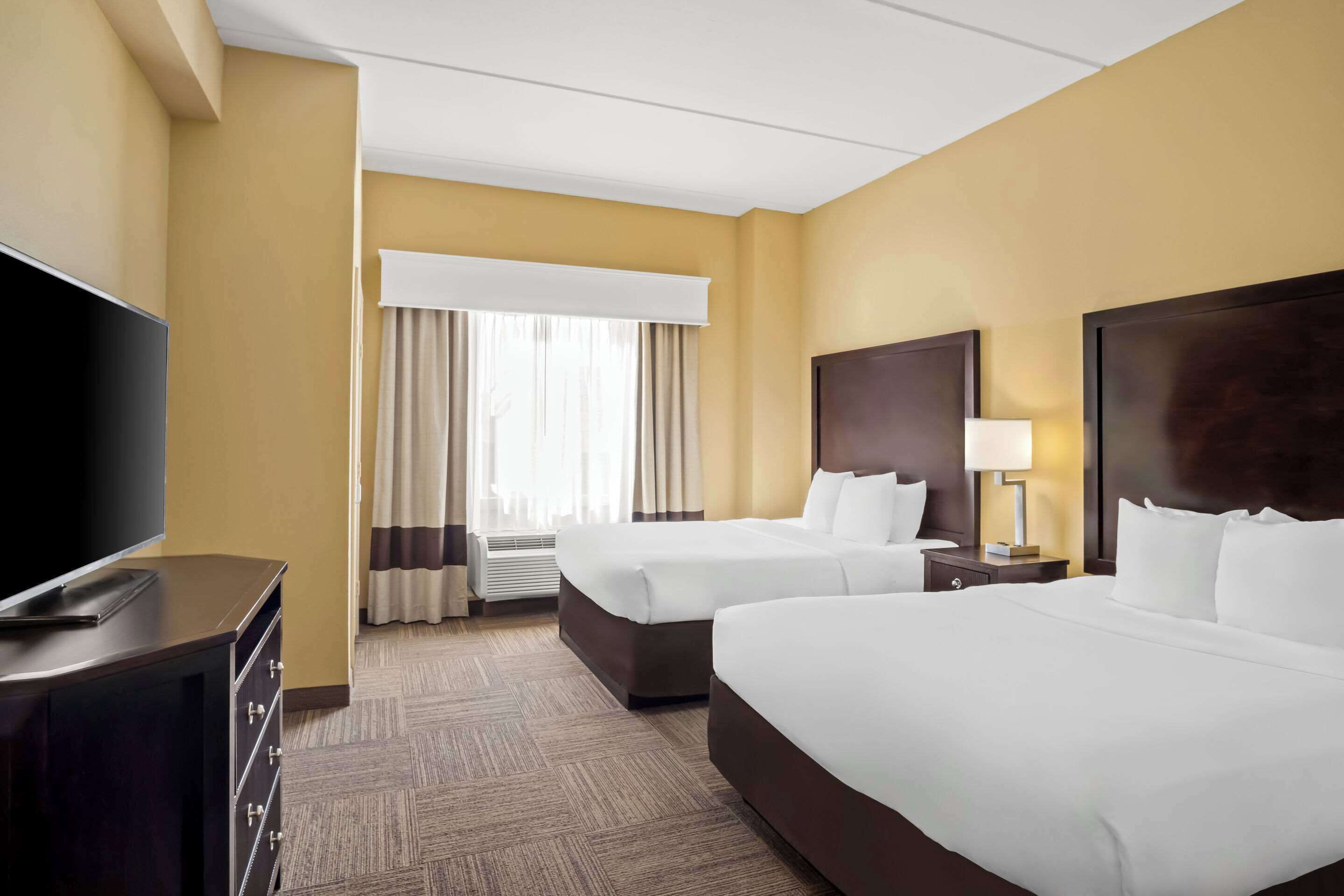 premium bedding, desk, laptop workspace, blackout curtains