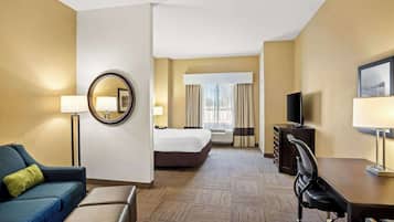 Premium bedding, desk, laptop workspace, blackout drapes