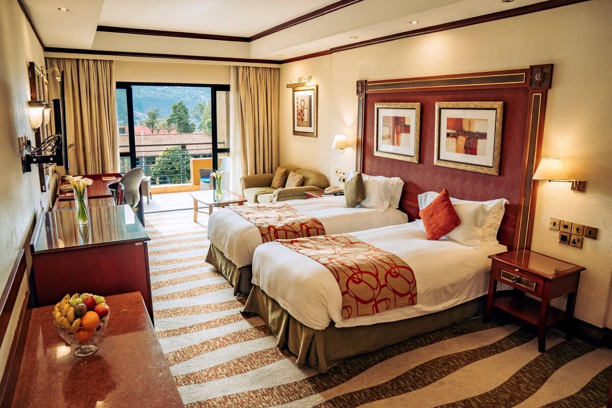 Superior Twin Room | Minibar, in-room safe, desk, laptop workspace