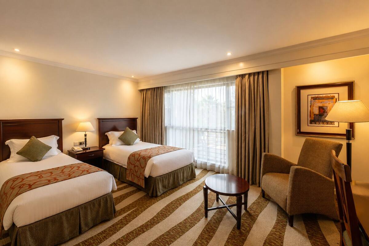 Standard Twin Room | Minibar, in-room safe, desk, laptop workspace