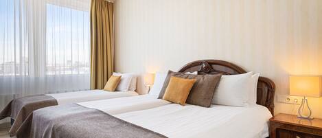 Standard Triple Room (with Free Parking) | 1 bedroom, desk, laptop workspace, blackout drapes