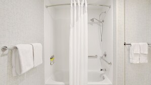 A modern bathroom with a walk-in shower, a bathtub, and a toilet. - Holiday Inn Express Hotel & Suites Tilton - Lakes Region by IHG (Tilton)