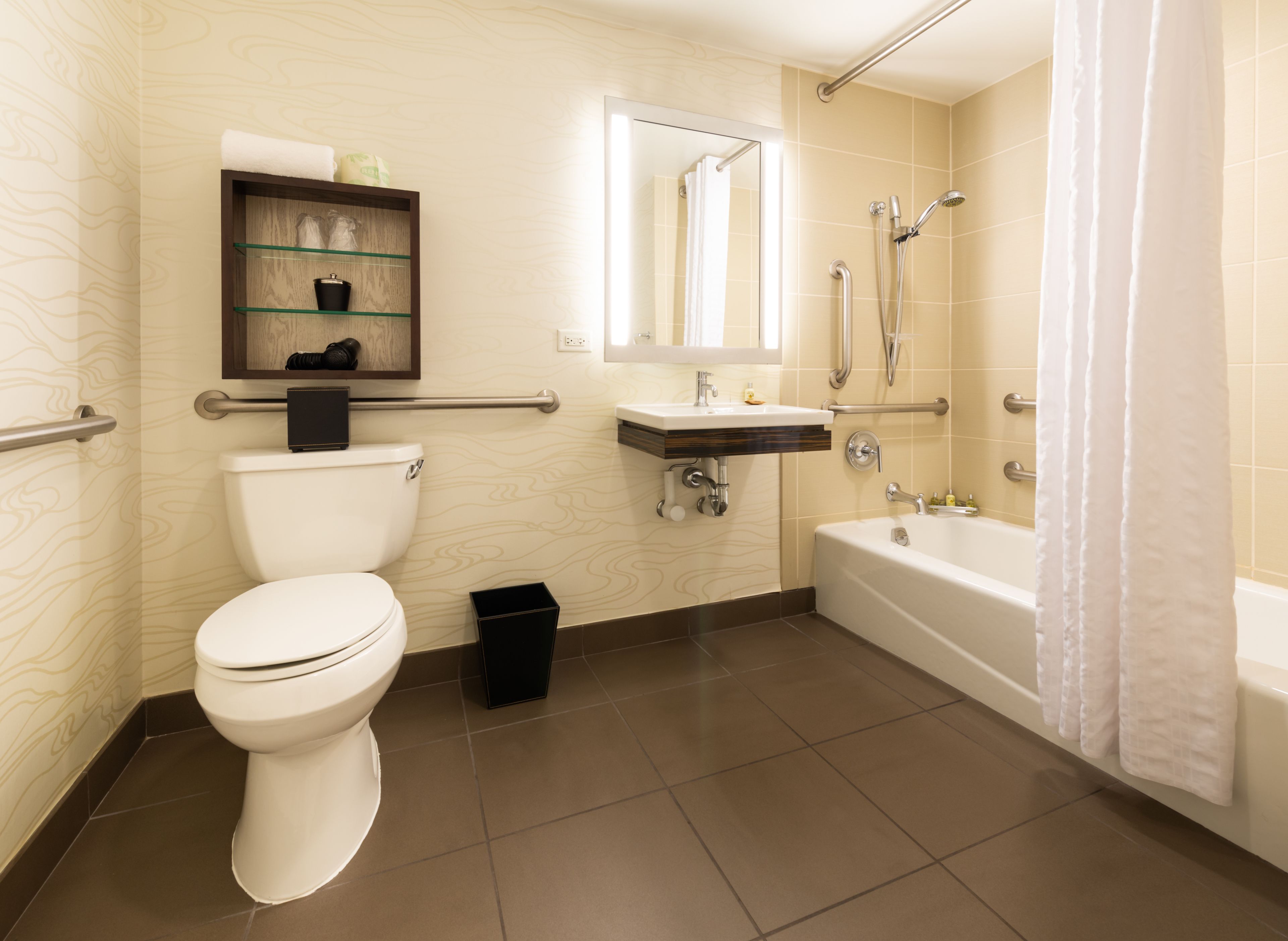 Un baño moderno con inodoro, lavamanos y bañera.