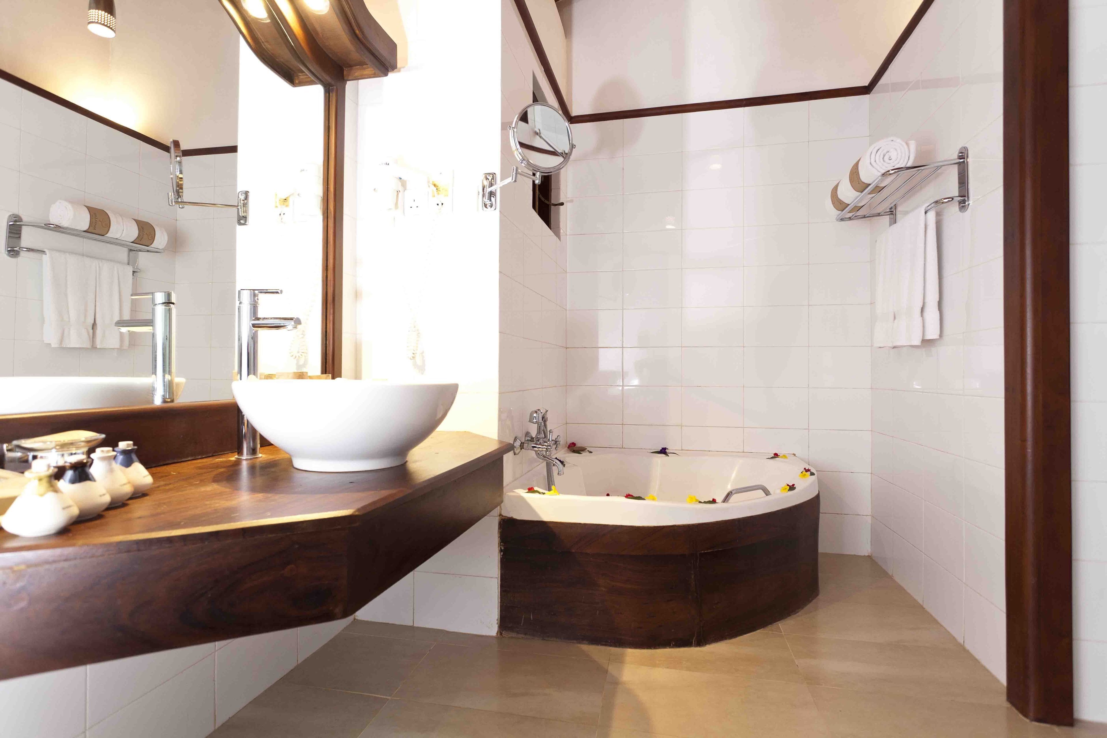 deep-soaking bathtub, rainfall showerhead, free toiletries, hair dryer