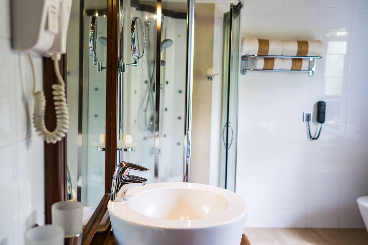 deep-soaking bathtub, rainfall showerhead, free toiletries, hair dryer