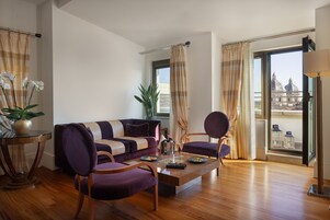 Executive Suite | Living area | 35-inch LCD TV with satellite channels, TV