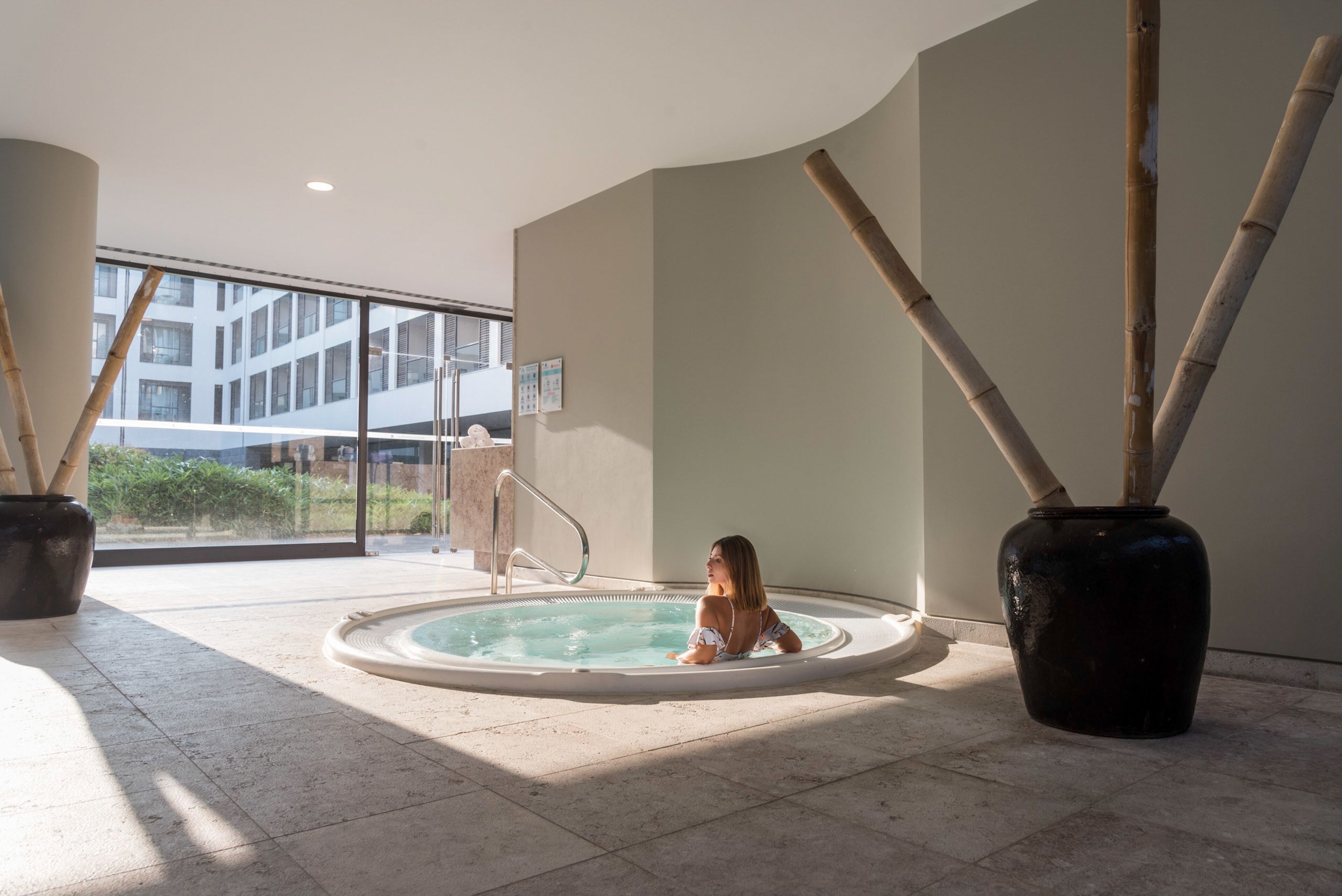 indoor pool, outdoor pool, pool umbrellas, pool loungers