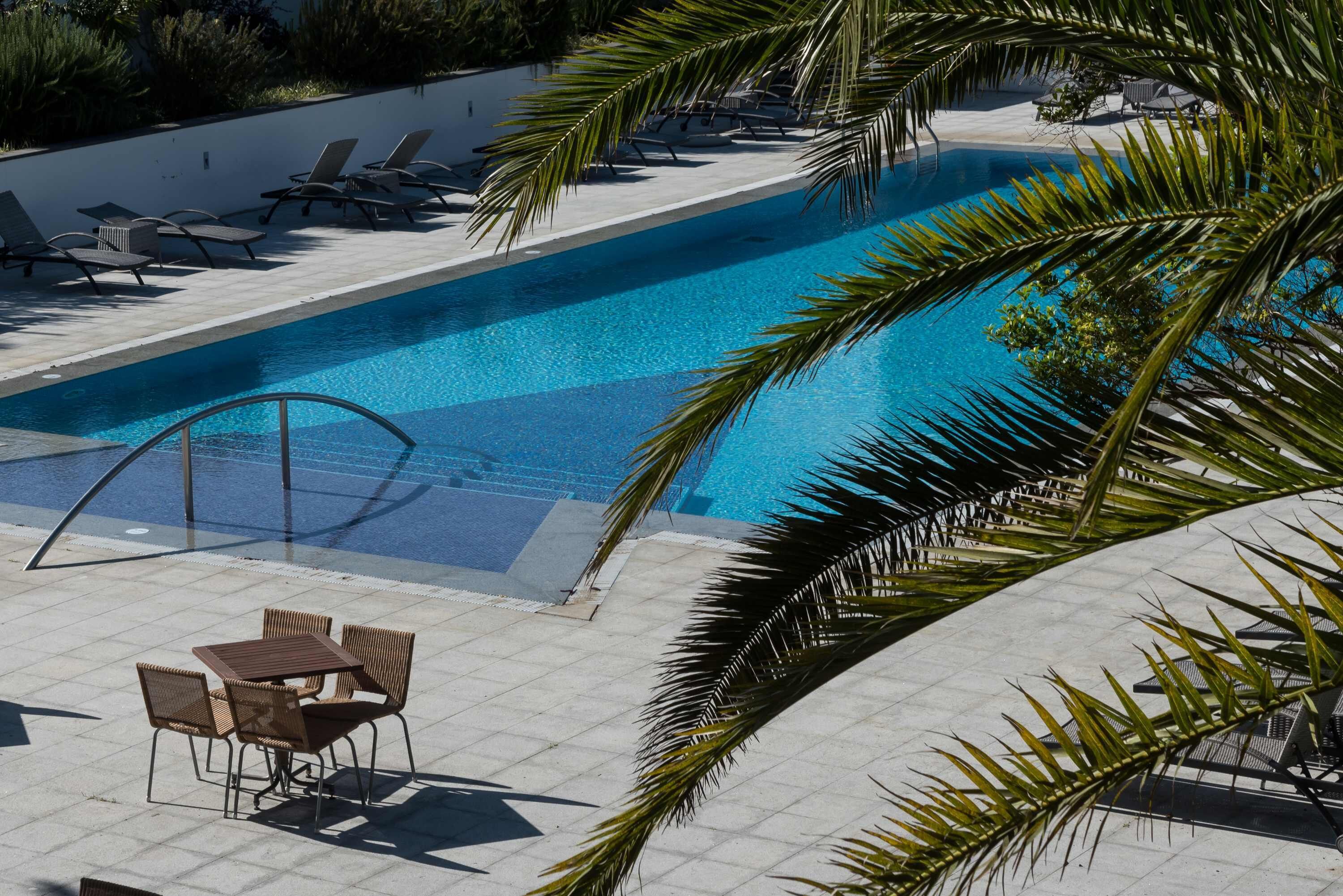 indoor pool, outdoor pool, pool umbrellas, pool loungers