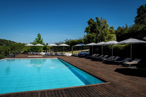 Seasonal outdoor pool, pool umbrellas, pool loungers