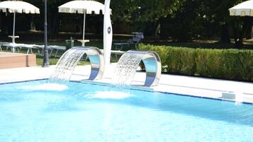 Seasonal outdoor pool, open 9:00 AM to 7:00 PM, pool umbrellas