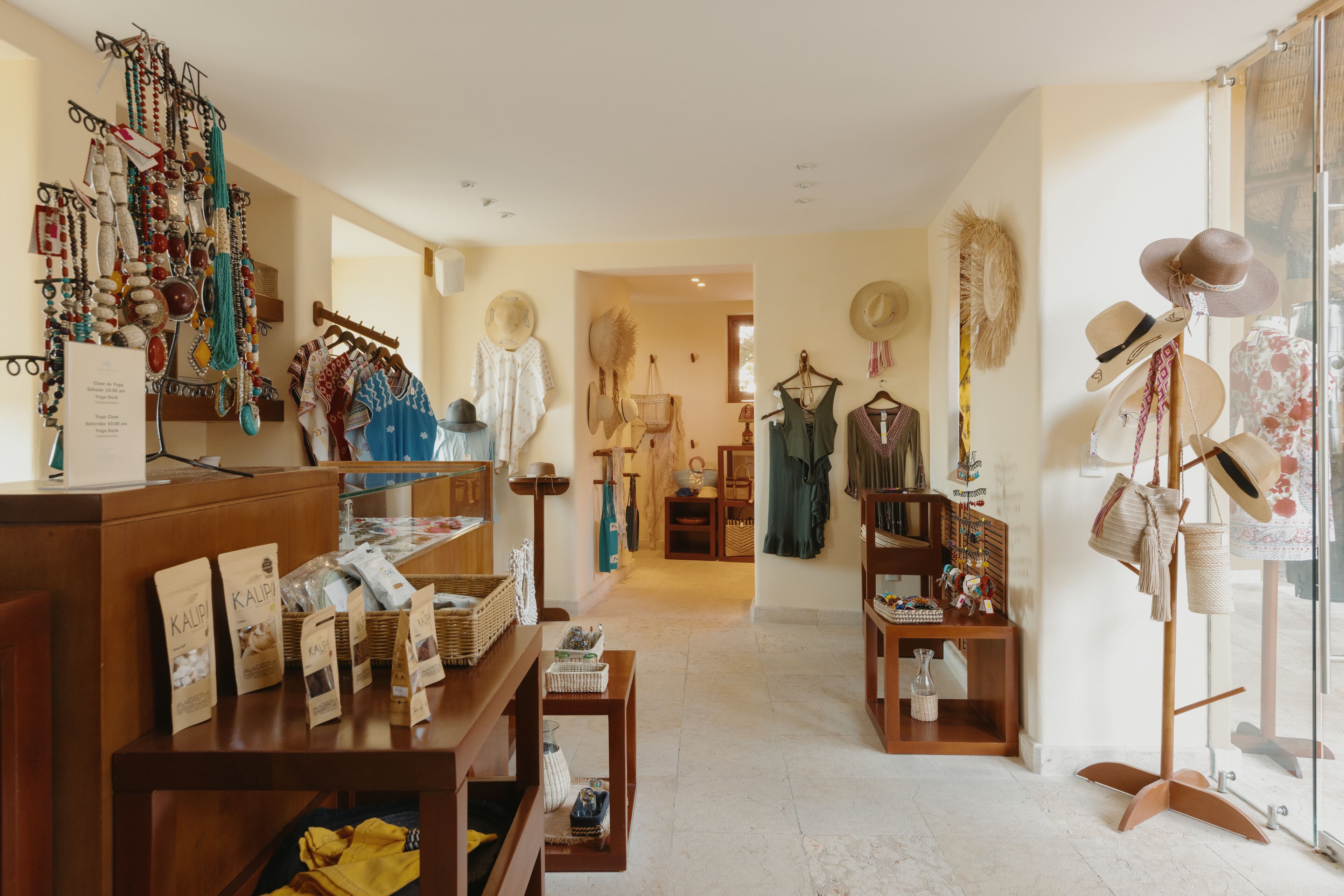 A boutique store with various hats and accessories displayed on shelves and racks.