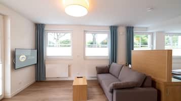 Apartamento | Zona de estar | Una televisión de pantalla plana