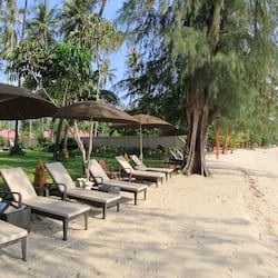 On the beach, sun-loungers, beach umbrellas, beach towels