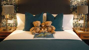 Family Room | Premium bedding, in-room safe, desk, iron/ironing board