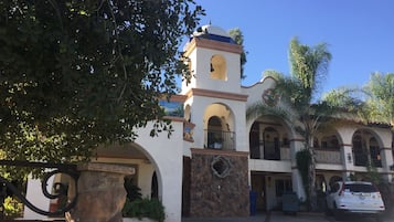 Explore a historic landmark with arched doorways and lush surroundings.
