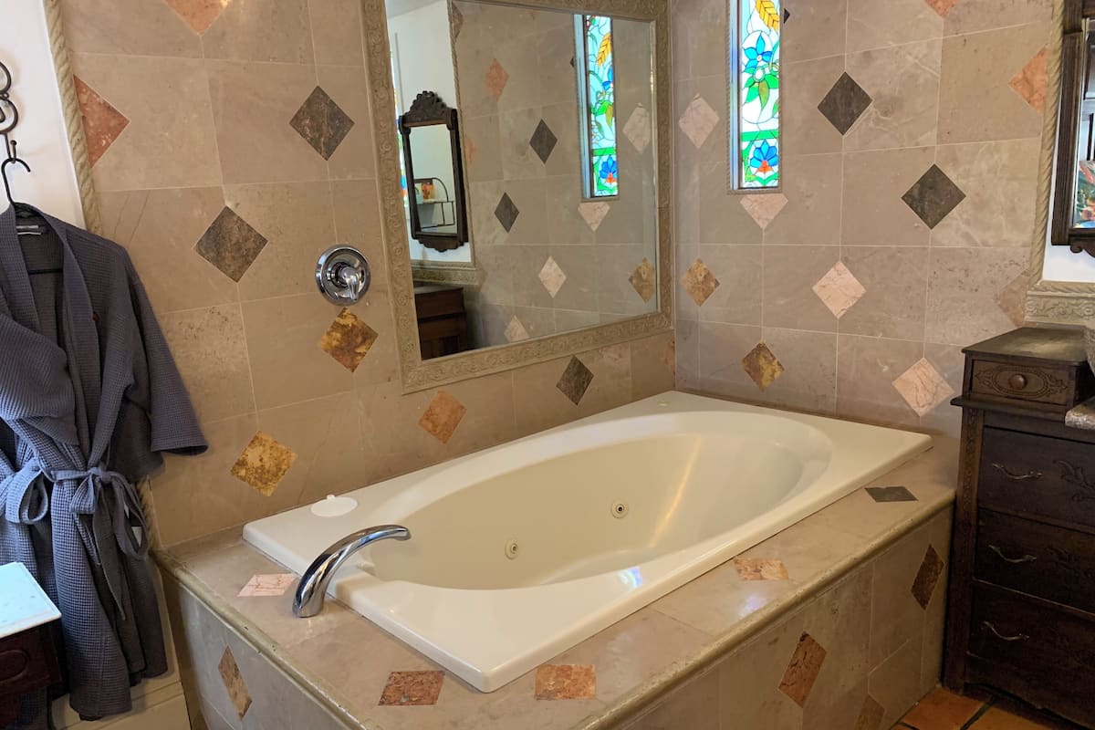 Combined shower/bathtub, free toiletries, hair dryer, bathrobes