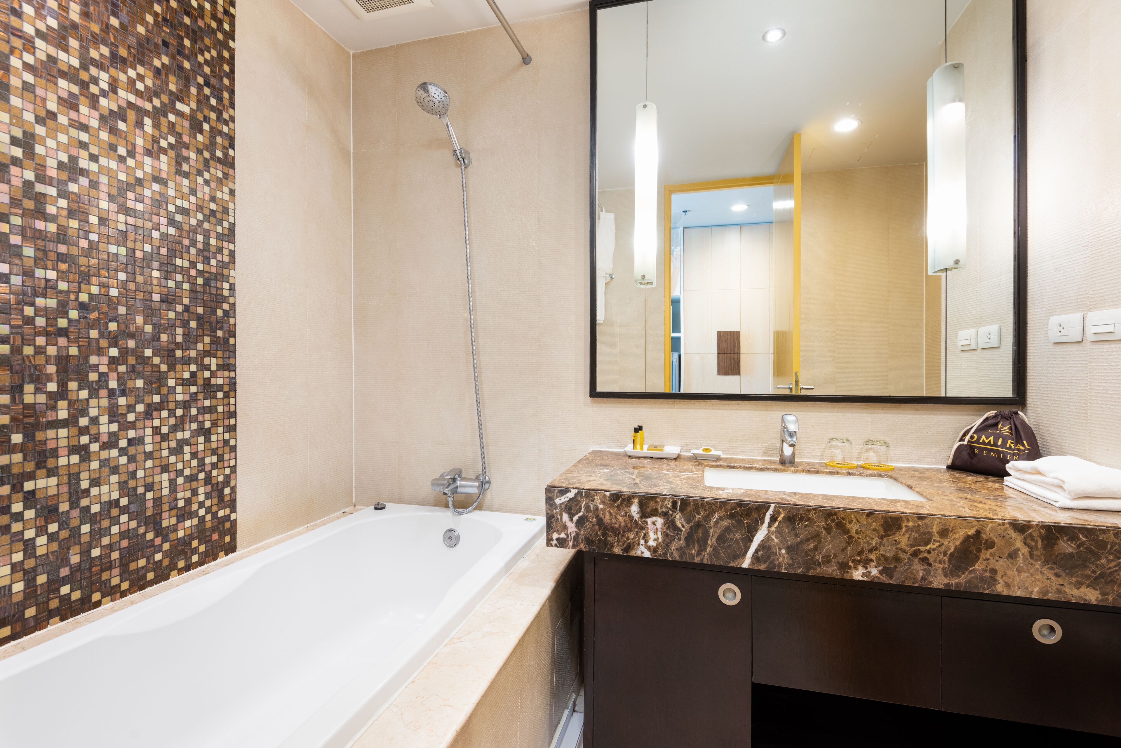 premier studio, 1 king bed with balcony | bathroom | combined shower/bathtub, deep-soaking bathtub, free toiletries