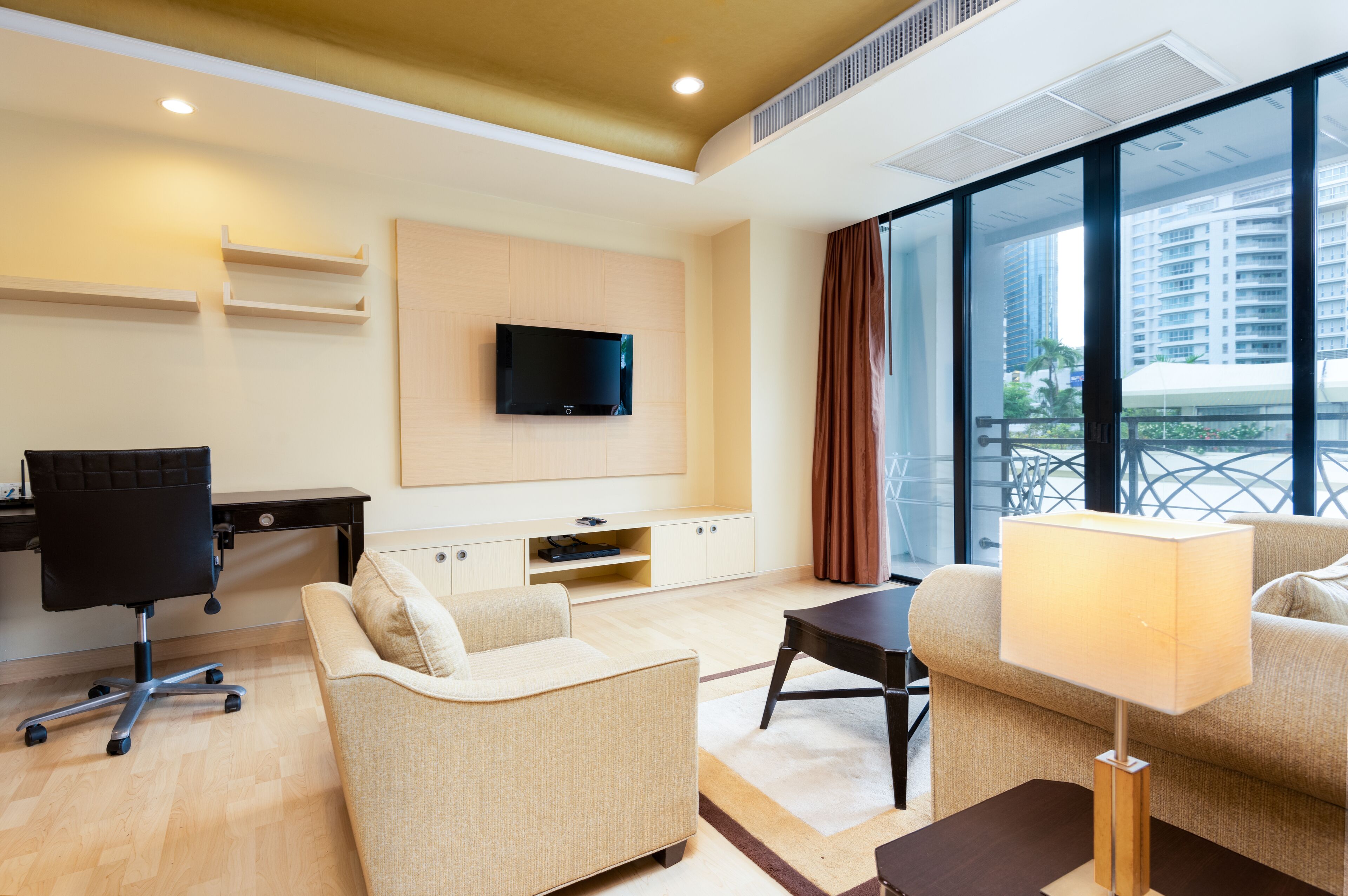 admiral one bedroom suite (3 adults) | living area | 32-inch lcd tv with satellite channels, tv, dvd player