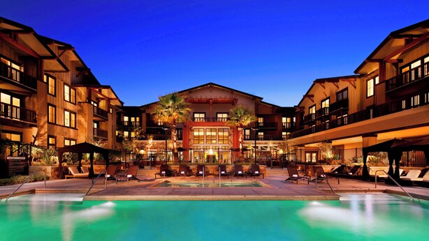A hotel with a swimming pool, outdoor seating, and a large building with multiple balconies. - The Westin Verasa Napa (Napa)