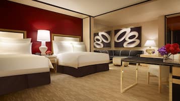 Une chambre d’hôtel avec deux lits, un bureau, un canapé et un grand miroir.