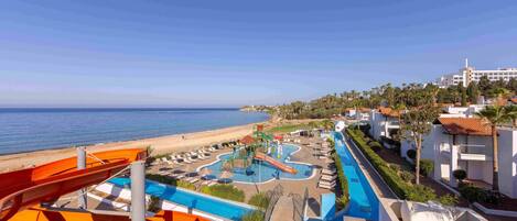 A resort with a water park, a pool, and a beach.