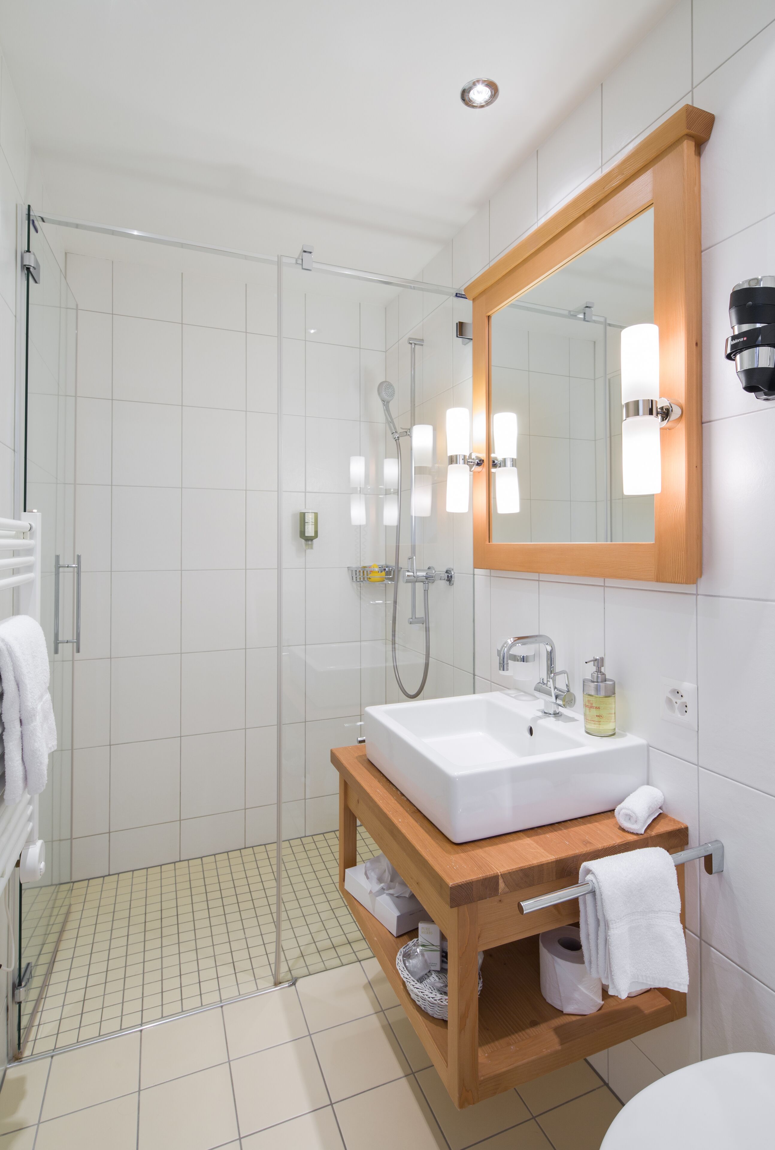 junior suite | bathroom | shower, rainfall showerhead, designer toiletries, hair dryer