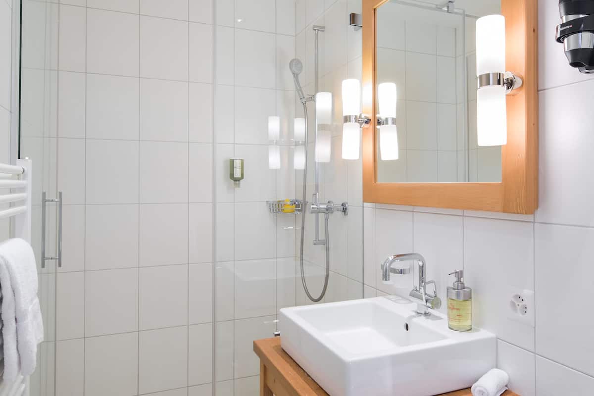 junior suite | bathroom | shower, rainfall showerhead, designer toiletries, hair dryer