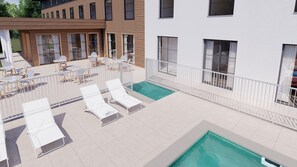 A rooftop pool area with lounge chairs and tables, surrounded by a white fence. - greet hôtel Le Teich Bassin d'Arcachon (Le Teich)