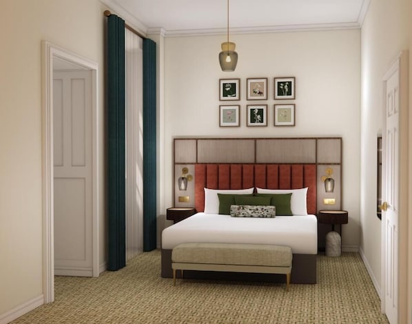 A hotel room with a large bed, a headboard with a wooden panel, two bedside tables with lamps, and a carpeted floor. - Parade Hotel Bath (Bath)