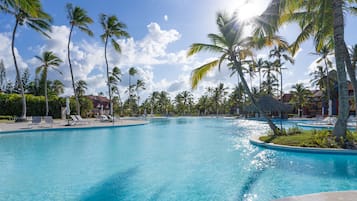 Outdoor pool, open 6 AM to 6 PM, pool umbrellas