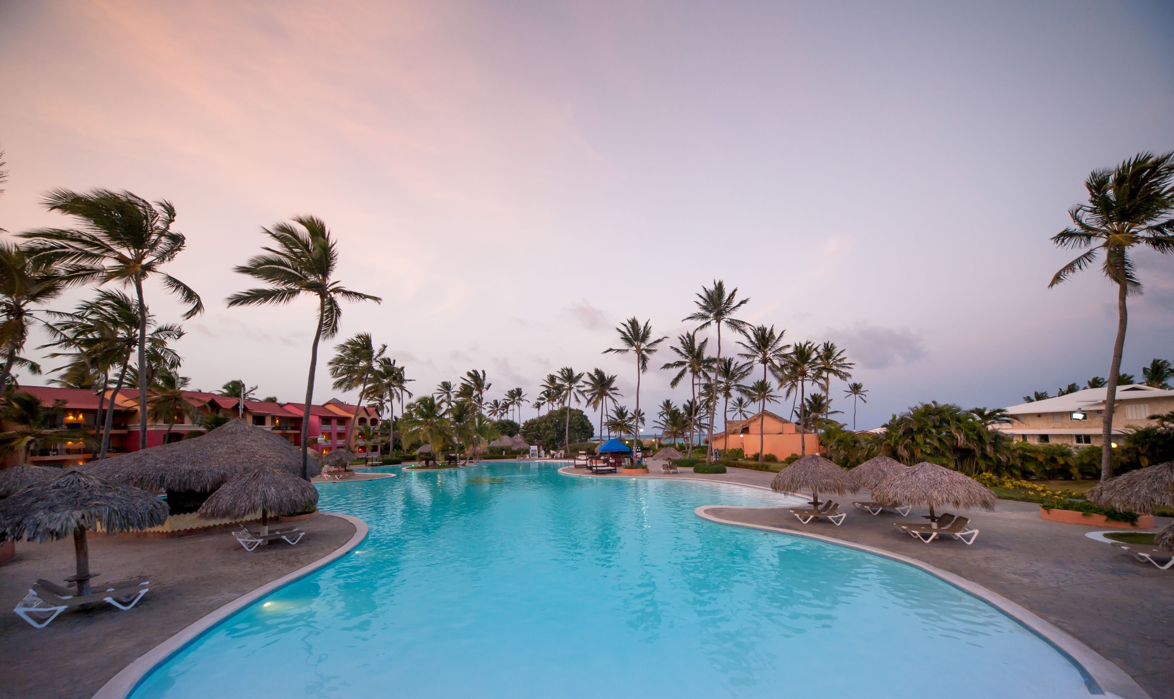 Outdoor pool, open 6 AM to 6 PM, pool umbrellas