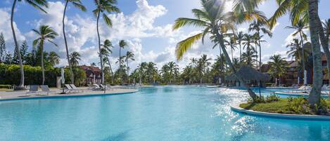 Outdoor pool, open 6 AM to 6 PM, pool umbrellas