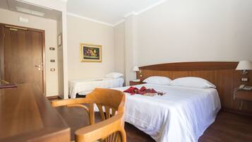 Triple Room | Minibar, in-room safe, desk, blackout drapes